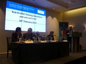 Ravi Aswani, The Rt Hon. Lord Justice Christopher Clarke, Alan van Praag, Dr. Aleka Sheppard and Martin Rowland at the podium introducing the triple event
