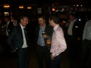 IUA's Chris Jones (centre) talking with guests