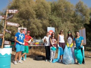 Students from the Geitona Private School explore MIO-ECSDE's mobile exhibition on marine litter after the beach cleanup at the Peace and Friendhip Stadium