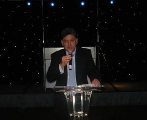 Dimitris Monioudis, president of the HESGB, pre-announcing the event