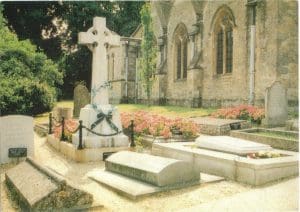 St Martin's, Bladon, cemetery. The Celtic cross marks Lord Randolph Churchill's grave; that of Winston and Clementine is at the front right with flowers.