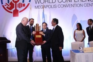MSC Peter Blohm receiving the Maritime Excellence Award from the Minister of the Canal and SG IMO and Ricardo Esquilsen MSC Legal Representative in Panama