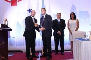 Stacy Hatfield from Manzanillo International Terminal receiving the Social Responsibility Award from the Panama Maritime Administrator Jorge Barakat