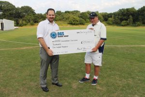 David Skinner, Managing Director of DGS Marine Group, presents DGS’s Marine’s donation to Richard Crow, CEO of the AMAR Foundation, at the DGS Marine Master’s Cup 2015 cricket tournament.