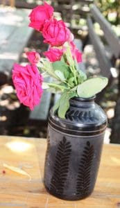 Style for the table: black pottery vase.