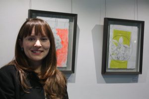Venetia Norris with two of her layered drawings.