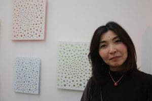 Yukako Shibata with works from her Shadowfall series.