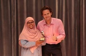 Outstanding Ambassador of the Year - Ms Kairunnisa Bte Abdul rahman with SingPost Group CEO Dr. Wolfgang Baier