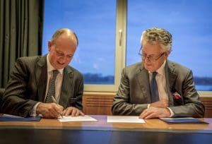 Sir Michael Bibby of Bibby Line Group and Kommer Damen of Damen Shipyards sign contract for Bibby WaveMaster 1
