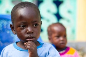 A child who lost members of his family to the Ebola virus plays at the Alliance for International Medical Action (ALIMA) Child Care Centre in Nzérékoré, Guinea. UN Photo/Martine Perret