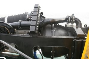The semi axial dredge pump is frame mounted and parts of the trailing pipe
