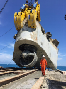 Ardent Naval Architect Roland De Marco walks in front of the bow piece of the Troll Solution after the salvage team cut and lifted it from theseabed.