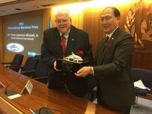 Dr. Frank Lawrence Wiswal Jr receiving the International Maritime prize from IMO's Secretary-General Kitack Lim
