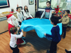 Santa entertaining the young children